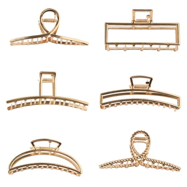 Six gold tone metal hair claw clips laid out on white