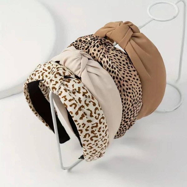 Knotted headbands in leopard, tan and cream stacked together